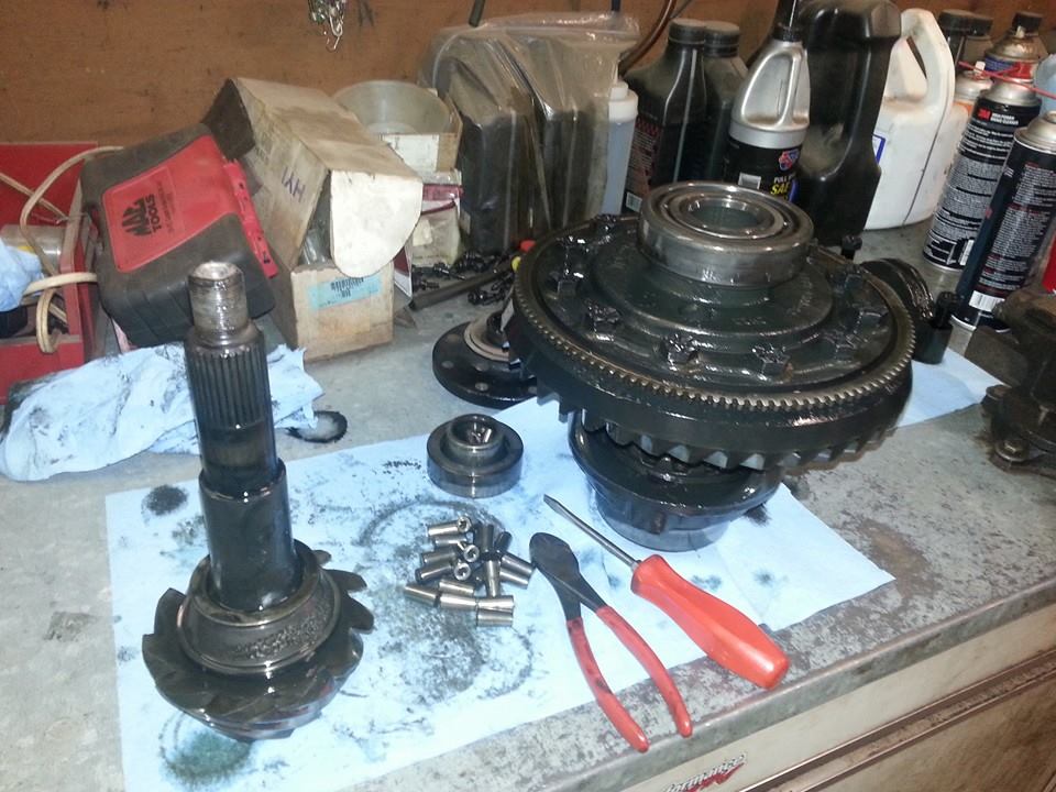 Mechanical components and tools on a workbench at Honest Auto